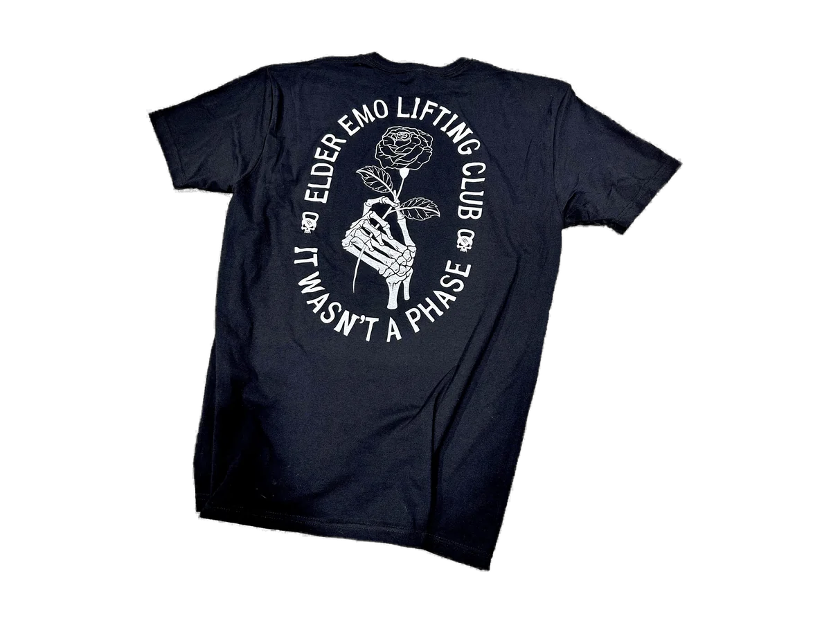 Back of the Dude That Lifts It Wasn't a Phase Tee, showing its rose-and-skeleton graphic on a transparent background.