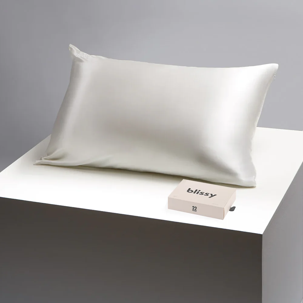 White Blissy silk pillowcase displayed with its branded 22-momme box.