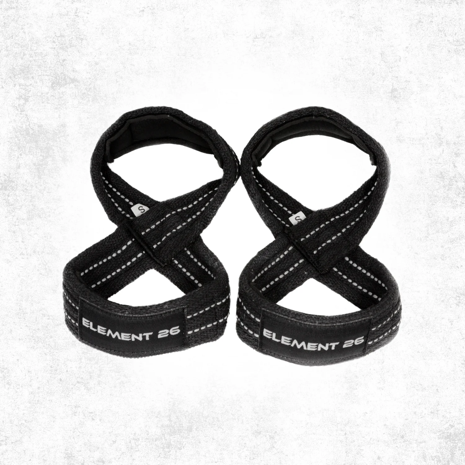 Pair of Element 26 padded black figure-8 weightlifting straps shown against a light textured studio background.