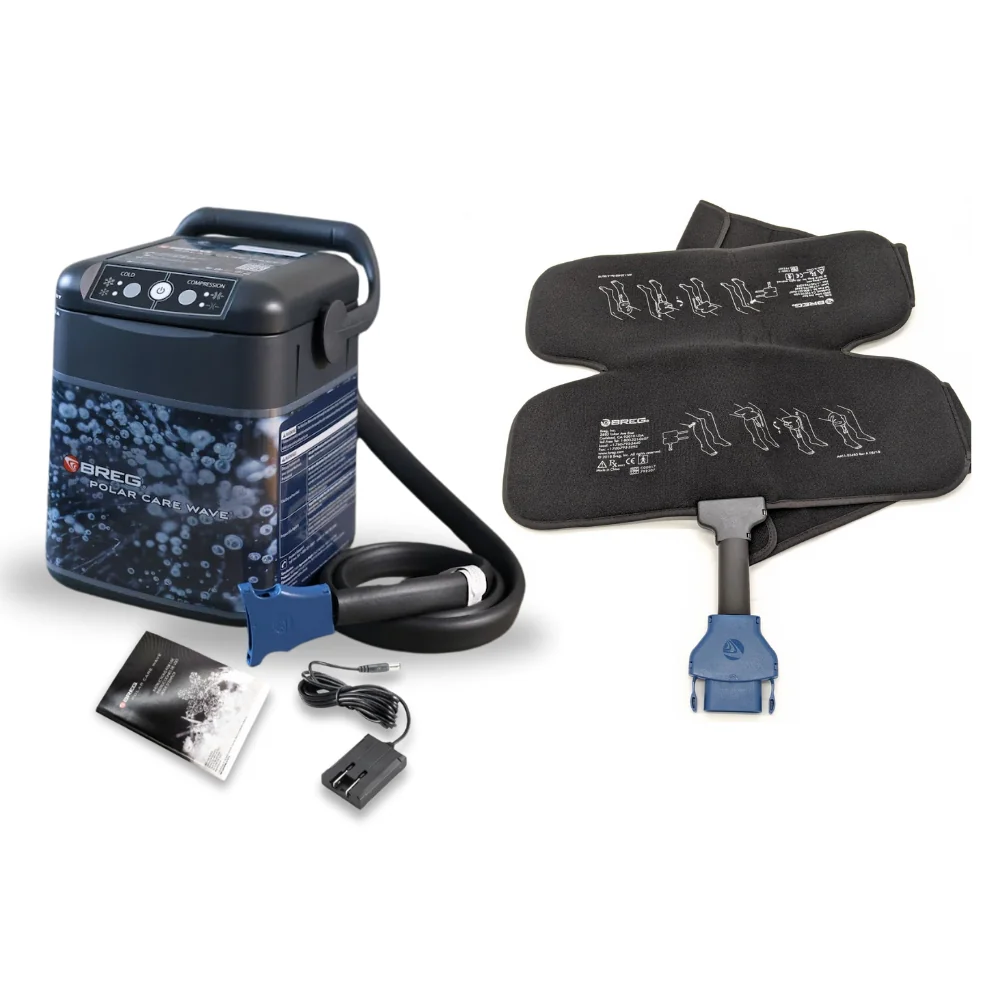 Breg Polar Care Wave cooler with regular knee compression pad, hose, power supply and instruction booklet on a white background.